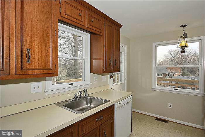 318 Whitestone Road Silver Spring, MD 20901 - Photo 11 of 28 a kitchen with a sink and a window