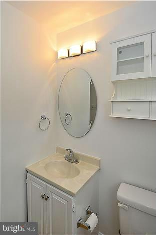 318 Whitestone Road Silver Spring, MD 20901 - Photo 13 of 28 a bathroom with a sink and a mirror