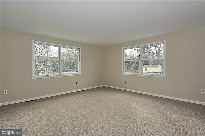 318 Whitestone Road Silver Spring, MD 20901 - Photo 22 of 28 an empty room with windows