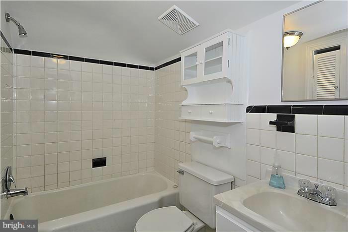 318 Whitestone Road Silver Spring, MD 20901 - Photo 25 of 28 a bathroom with a sink toilet and shower