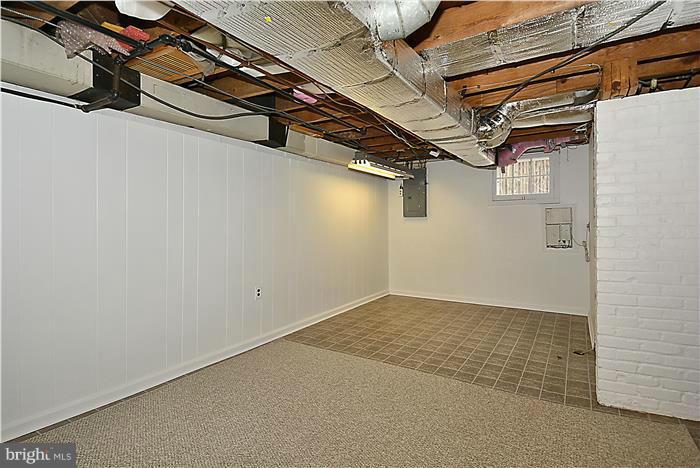318 Whitestone Road Silver Spring, MD 20901 - Photo 26 of 28 a view of a room with racks on the wall