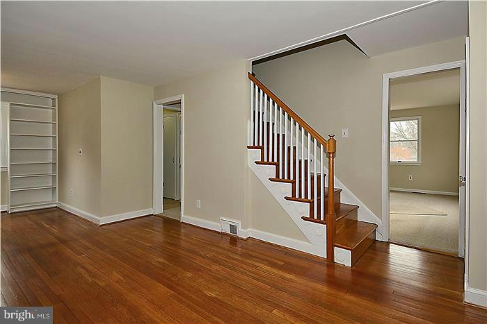 318 Whitestone Road Silver Spring, MD 20901 - Photo 4 of 28 a view of an entryway with wooden floor and door