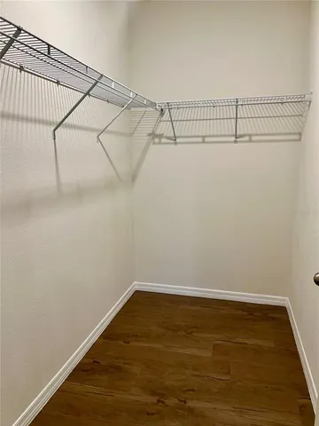 a stove top oven sitting inside of a kitchen