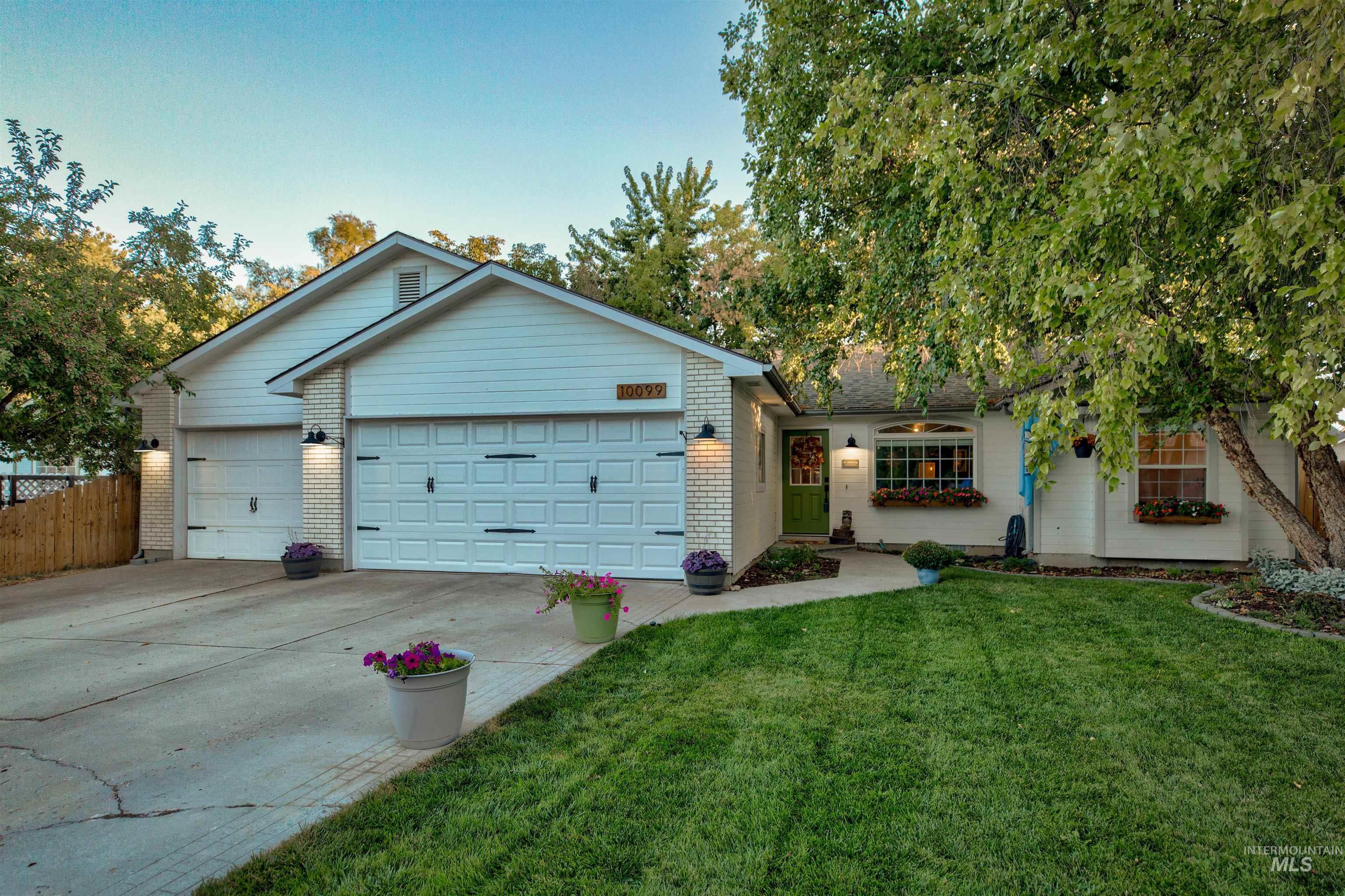 Ranch-style home with brick siding, concrete driveway, and an attached garage
