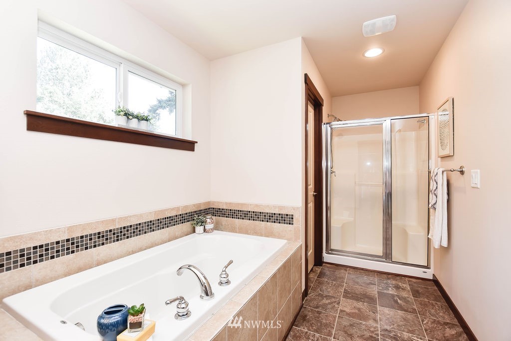 1623 241st Street Southwest Bothell, WA 98021 - Photo 22 of 39 a bathroom with a tub and a shower
