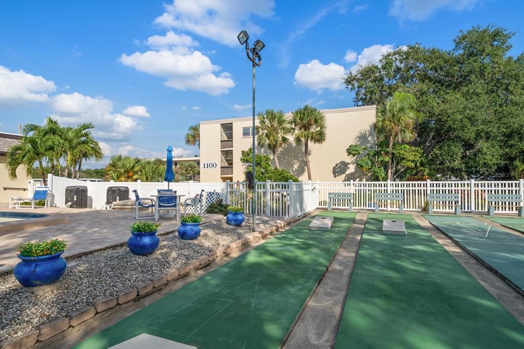 a view of a backyard with sitting area