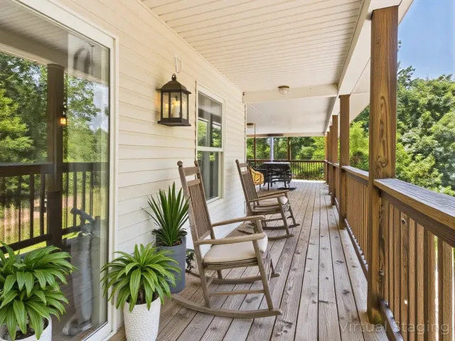 a view of a dining room with furniture and a chandelier