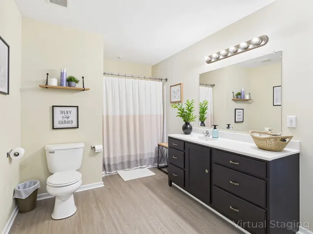 a hallway with a couch and a large window with garden view