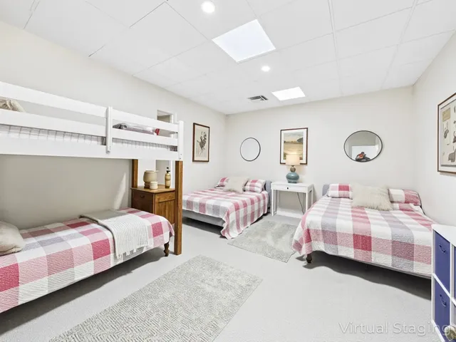 a living room with furniture a rug and a large window