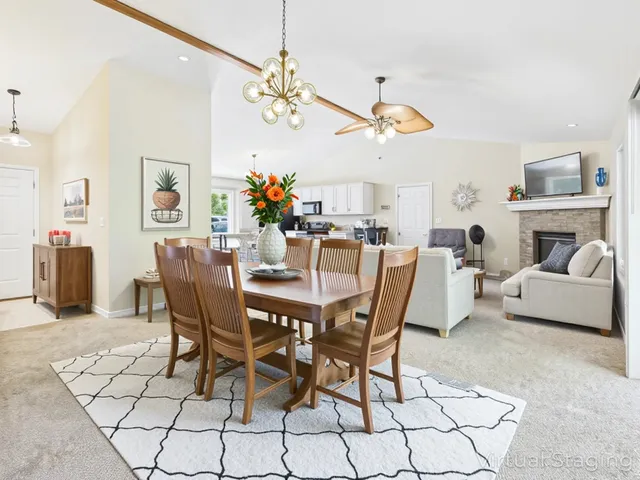 a view of a patio with table and chairs and potted plants with wooden floor and fence