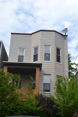 a front view of house with garden
