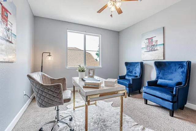 a bedroom with bed and wall painting