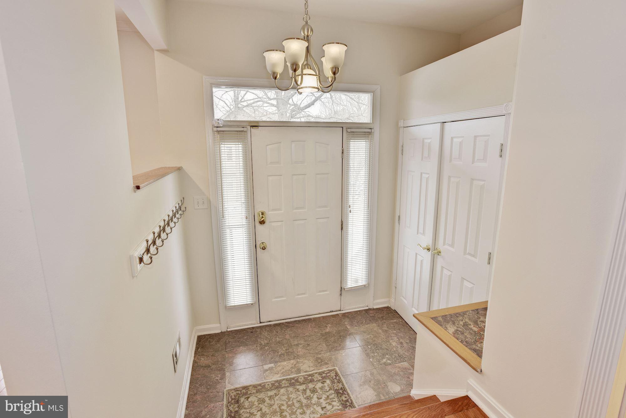 5133 Columbia Road, Unit 1595 Columbia, MD 21044 - Photo 2 of 30 a view of a chandelier in a room