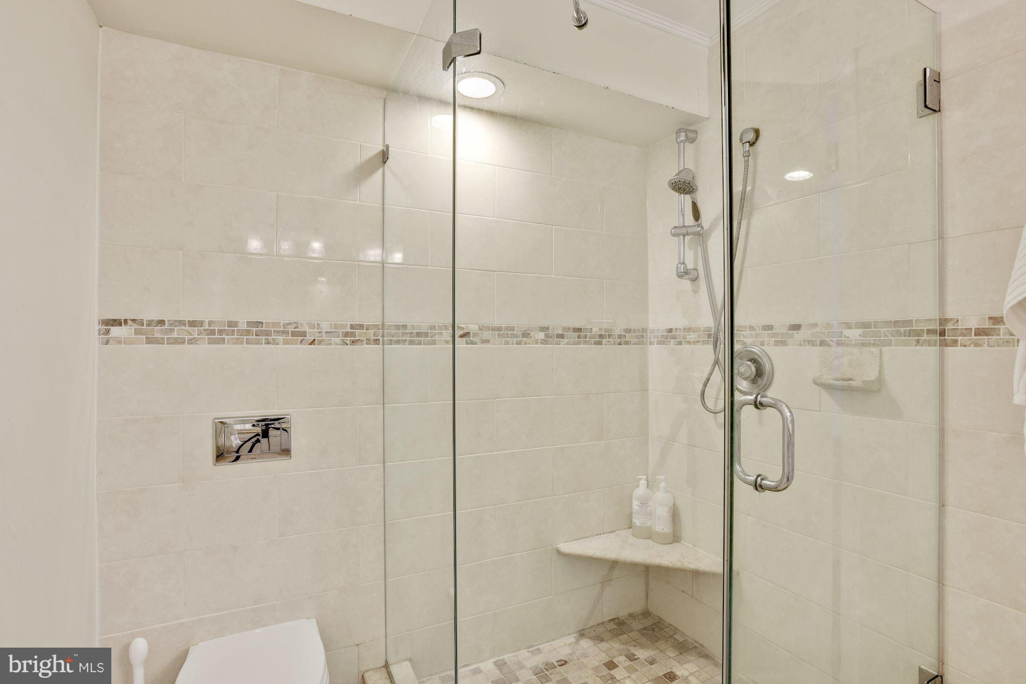 5133 Columbia Road, Unit 1595 Columbia, MD 21044 - Photo 15 of 30 a bathroom with a shower and toilet