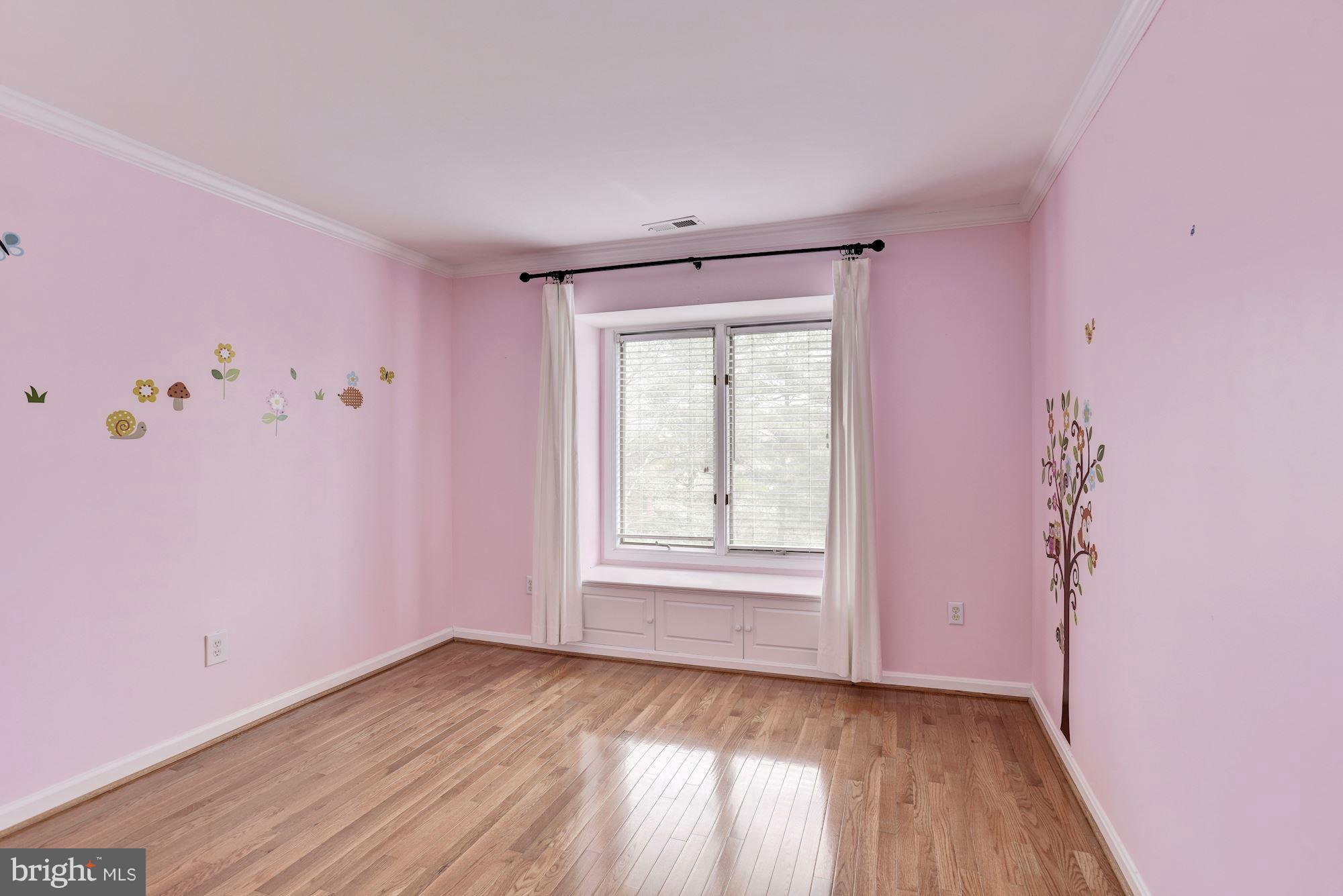 5133 Columbia Road, Unit 1595 Columbia, MD 21044 - Photo 18 of 30 an empty room with wooden floor and windows