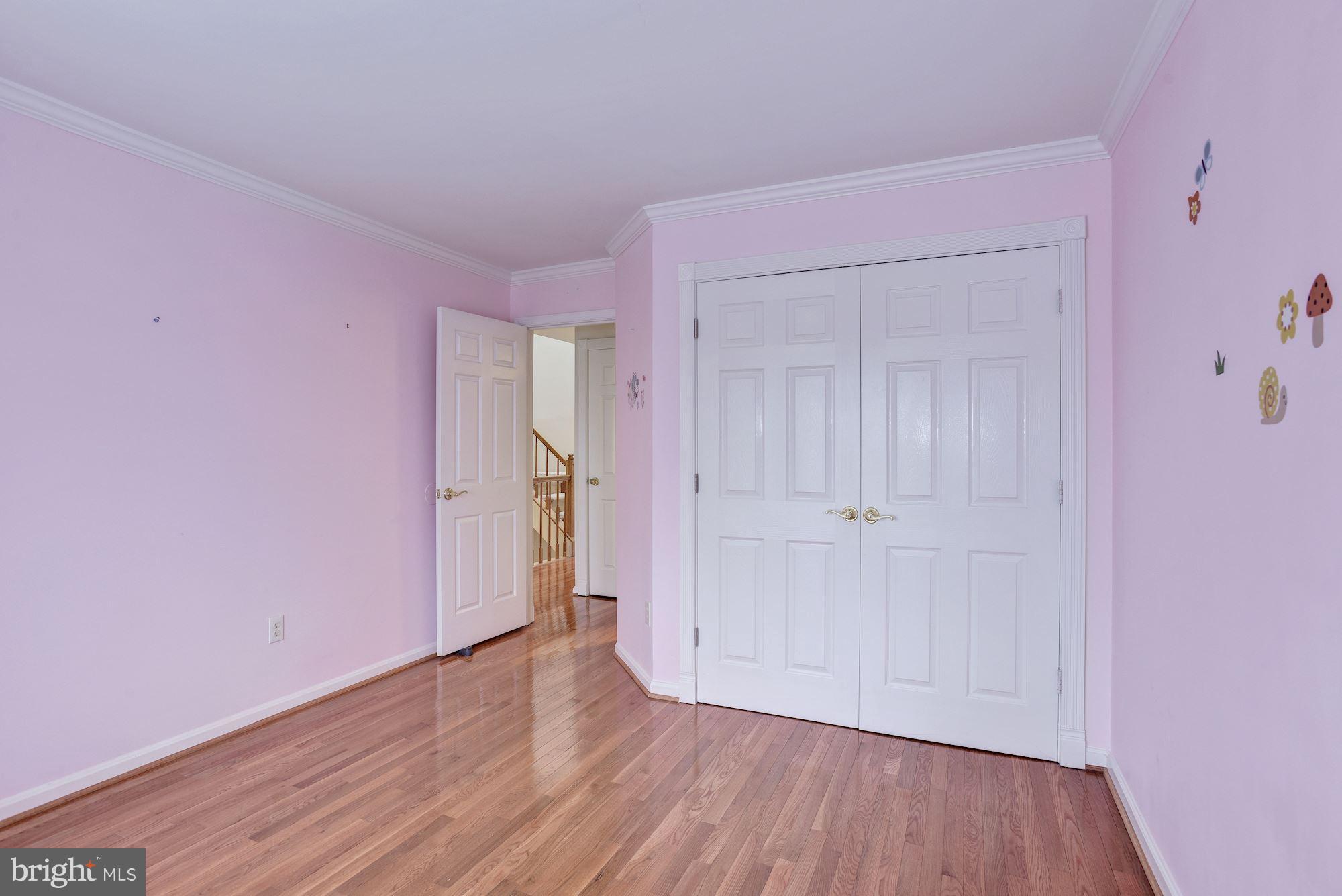 5133 Columbia Road, Unit 1595 Columbia, MD 21044 - Photo 19 of 30 a view of an empty room with wooden floor