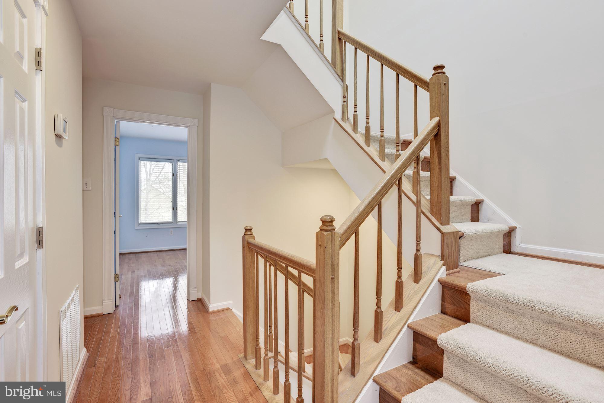 5133 Columbia Road, Unit 1595 Columbia, MD 21044 - Photo 21 of 30 a view of entryway and hall with wooden floor