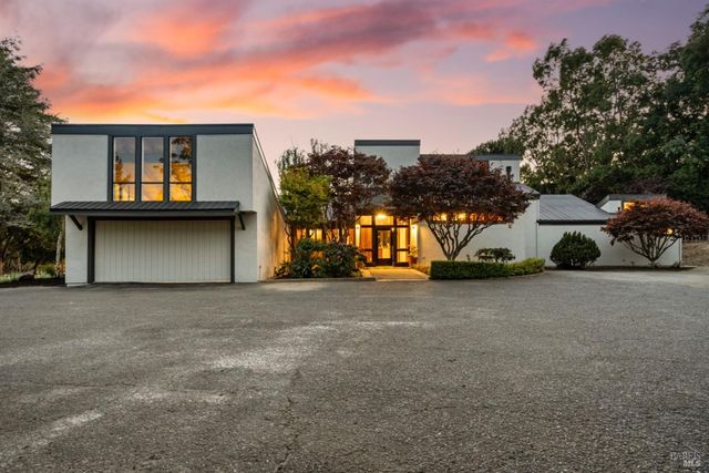 a car parked in front of a house