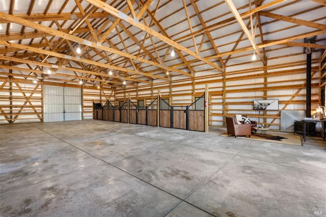 a view of a garage with parked cars