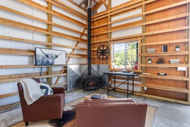 a reading room with furniture and a window