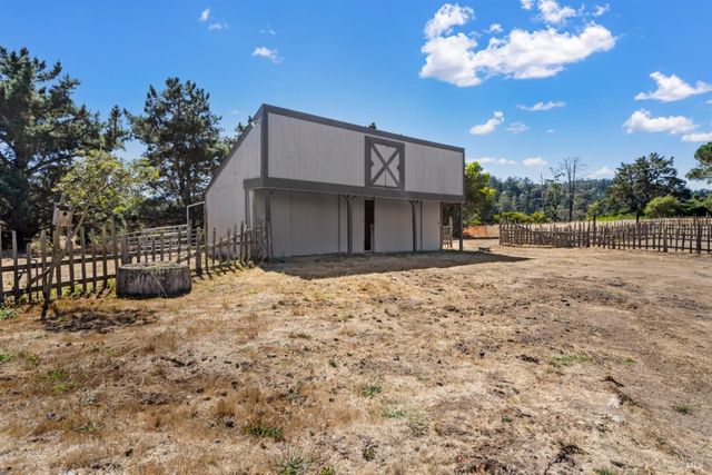 a view of a house with a snow in the yard