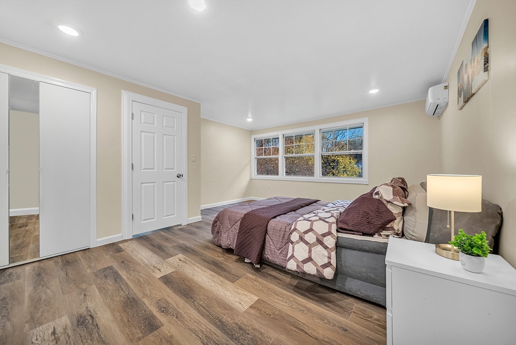 9 Donna Road Chelmsford, MA 01824 - Photo 17 of 37 a bedroom with a bed and wooden floor