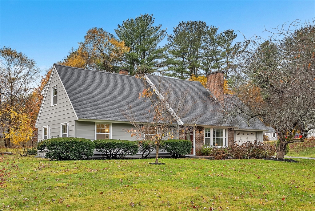 9 Donna Road Chelmsford, MA 01824 - Photo 36 of 37 a front view of a house with a garden and trees
