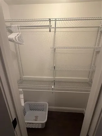 a view of a room with racks on the wall