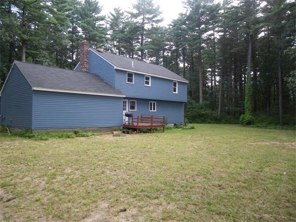 127 Patten Road Tewksbury, MA 01876 - Photo 13 of 16 a backyard of a house with lots of green space