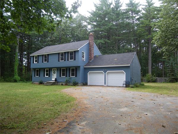 127 Patten Road Tewksbury, MA 01876 - Photo 15 of 16 a view of a house with yard and a tree