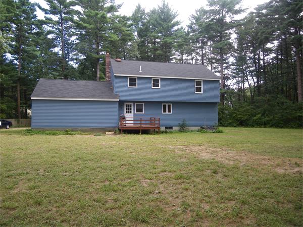 127 Patten Road Tewksbury, MA 01876 - Photo 16 of 16 a front view of a house with a yard