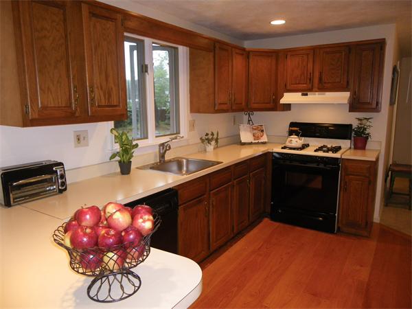 127 Patten Road Tewksbury, MA 01876 - Photo 2 of 16 a kitchen with a sink cabinets and window