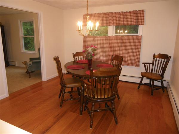 127 Patten Road Tewksbury, MA 01876 - Photo 4 of 16 a view of a dining room with furniture and wooden floor