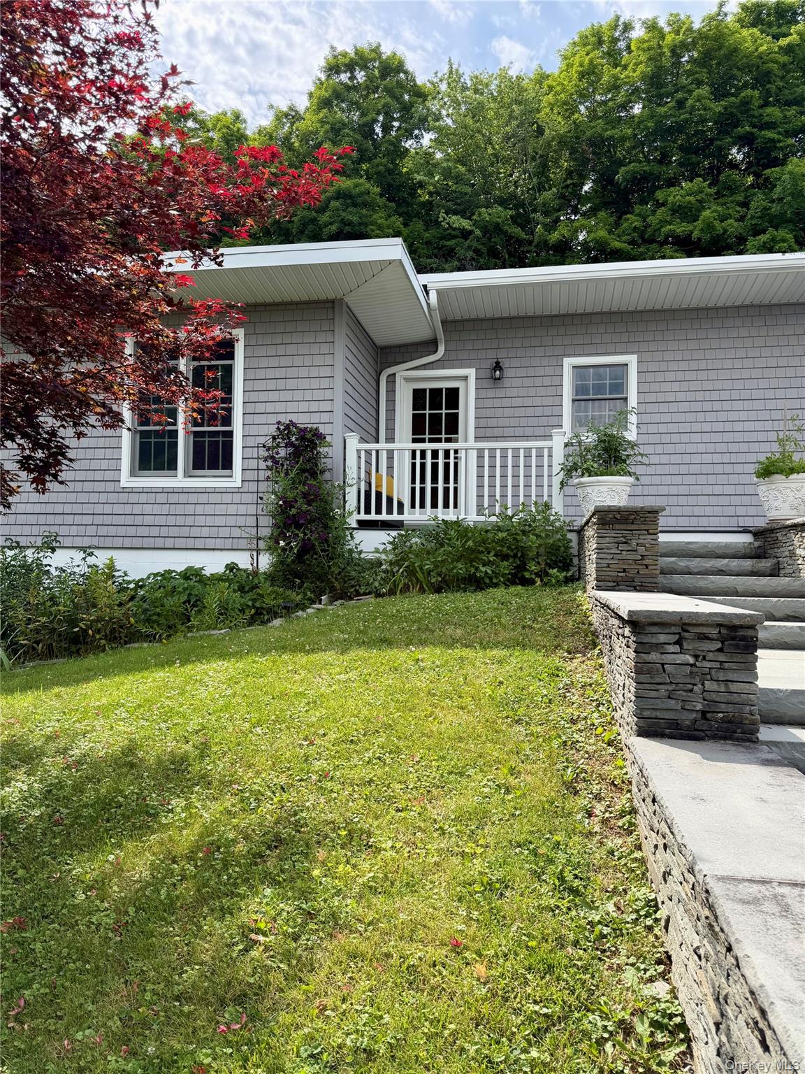 91-97 Sawmill Road Red Hook, NY 12571 - Photo 2 of 11 a house view with a garden space