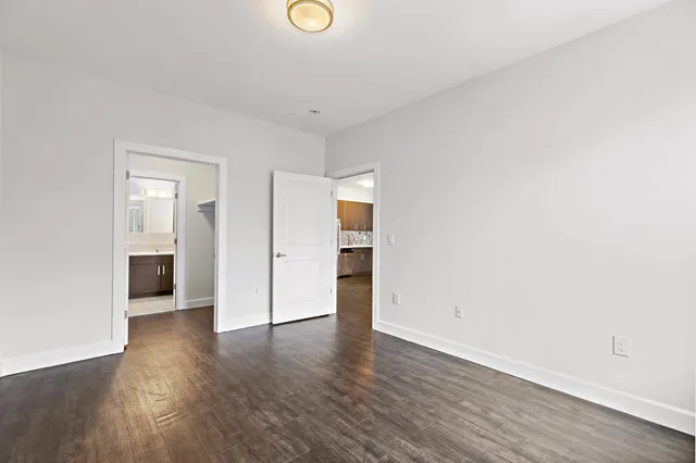 a view of a livingroom with wooden floor