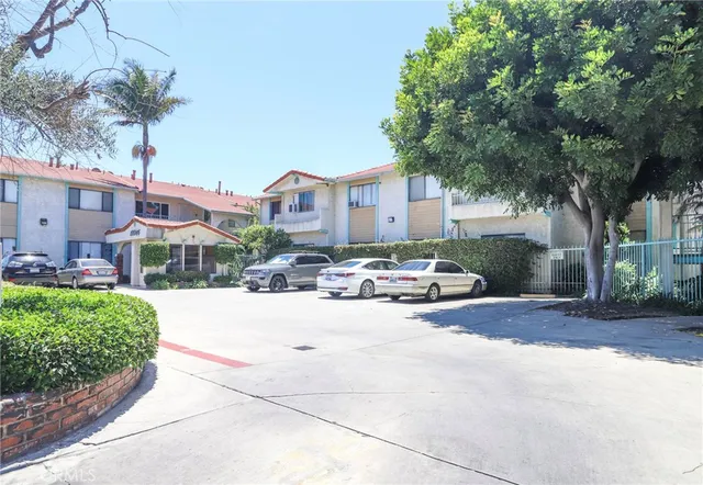 a view of a street with a car parked in front of it