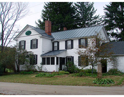 6 Rattlesnake Gutter Road Leverett, MA 01054 - Photo 1 of 13 a front view of a house with a garden