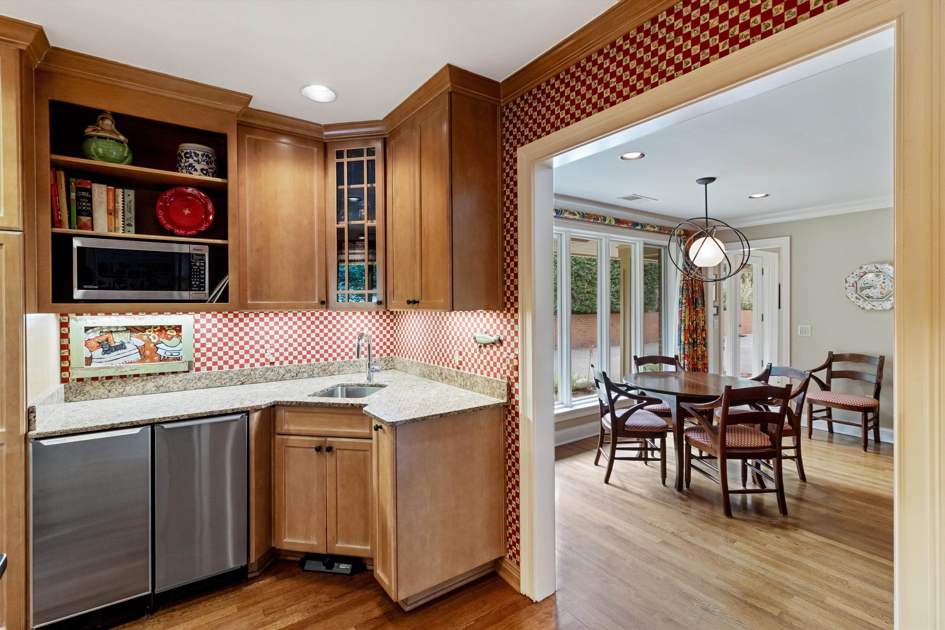 4501 Minden Road Memphis, TN 38117 - Photo 11 of 25 a kitchen with granite countertop cabinets a dining table and chairs
