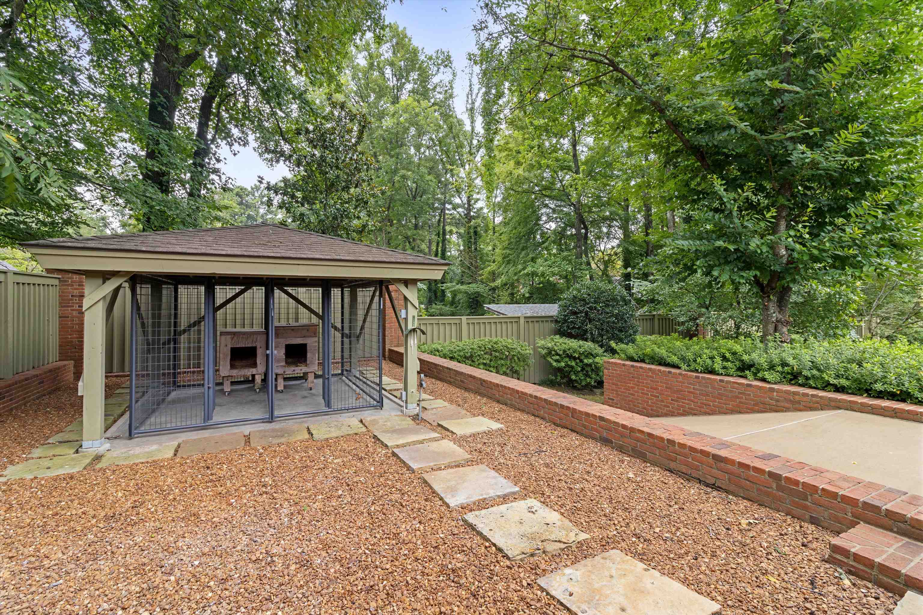 4501 Minden Road Memphis, TN 38117 - Photo 25 of 25 a view of a patio with table and chairs under an umbrella with wooden floor