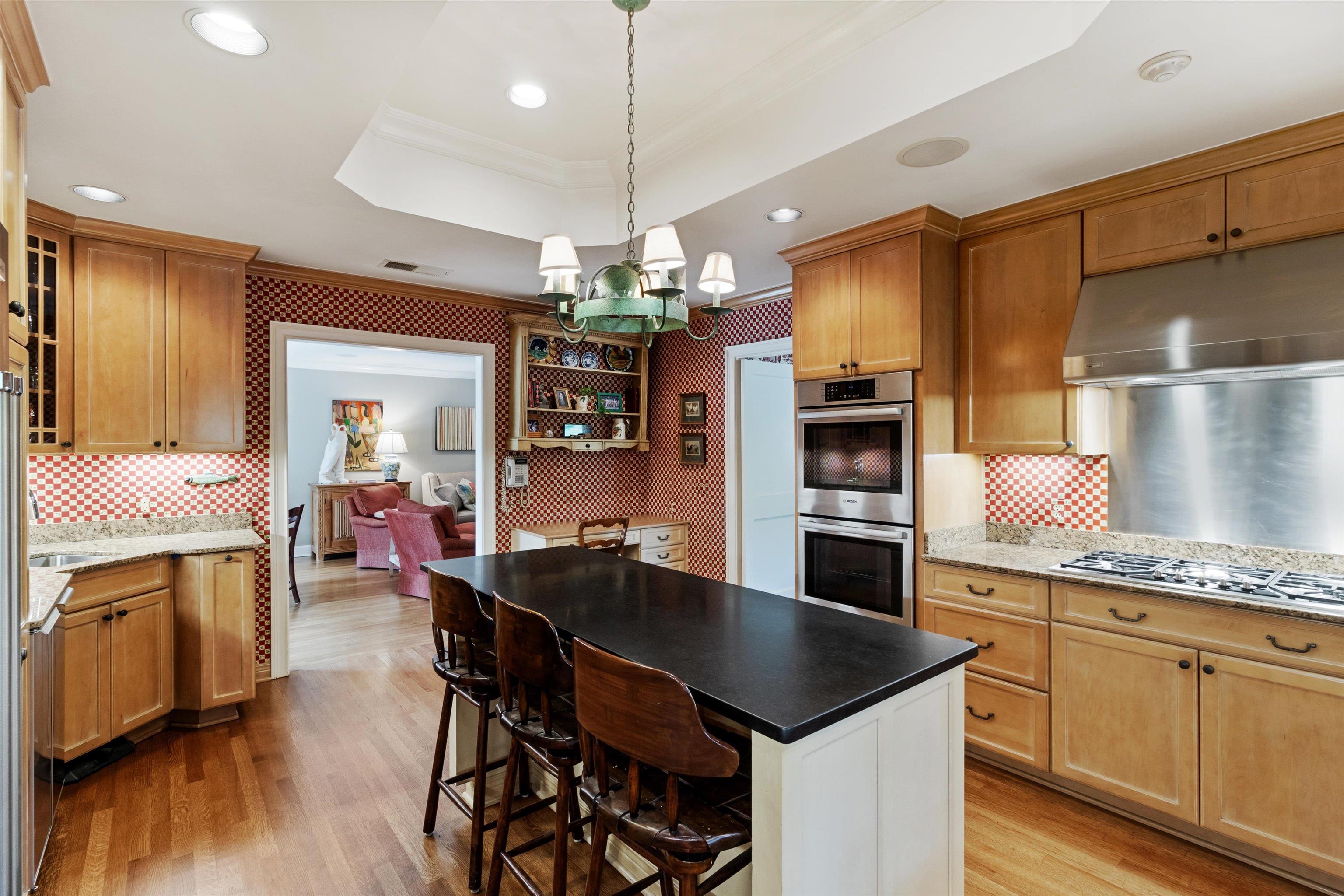 4501 Minden Road Memphis, TN 38117 - Photo 10 of 25 a kitchen with a table chairs refrigerator and microwave