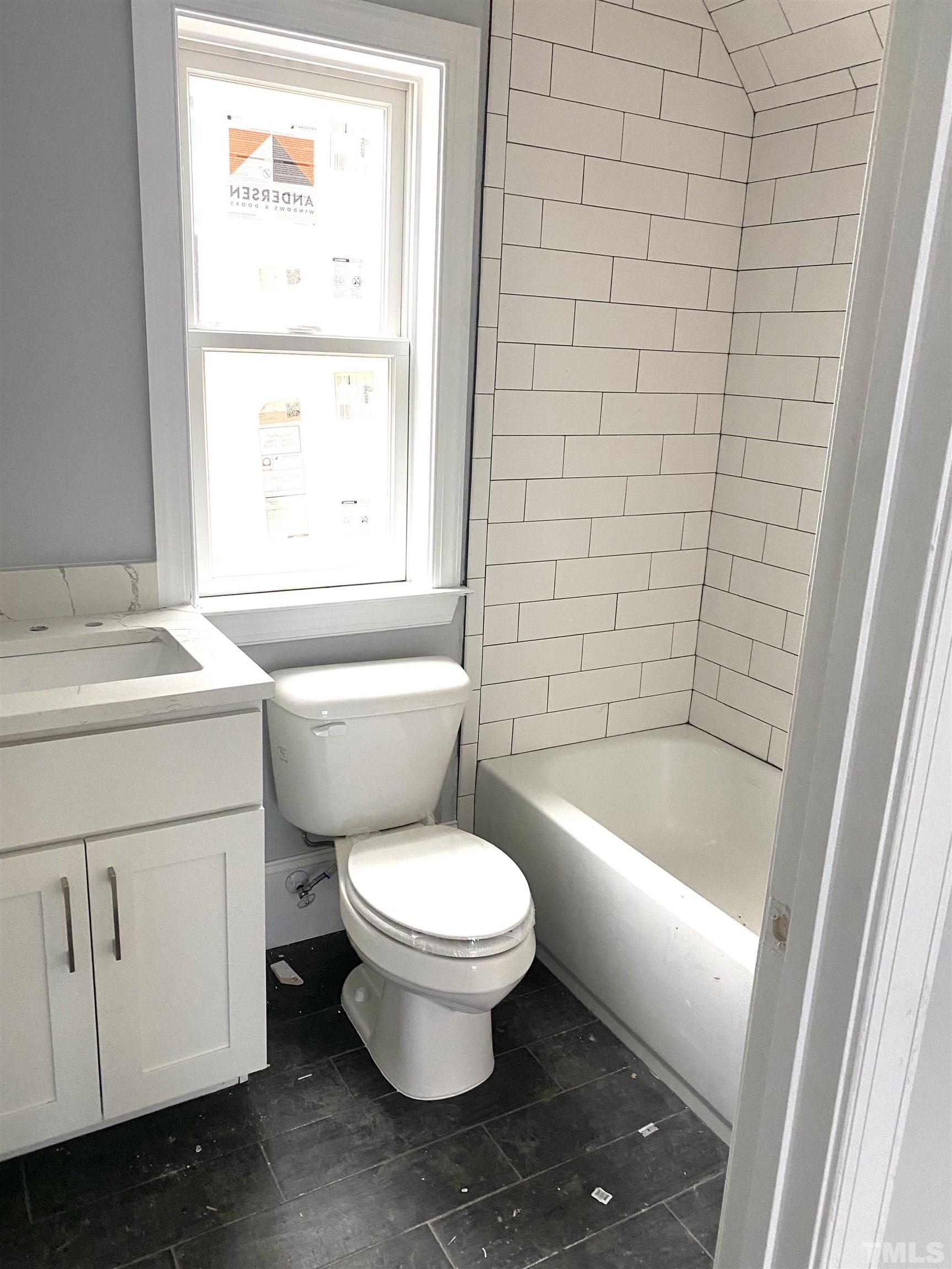 308.5 Furches Street Raleigh, NC 27607 - Photo 13 of 19 a white toilet sitting next to a bathroom sink