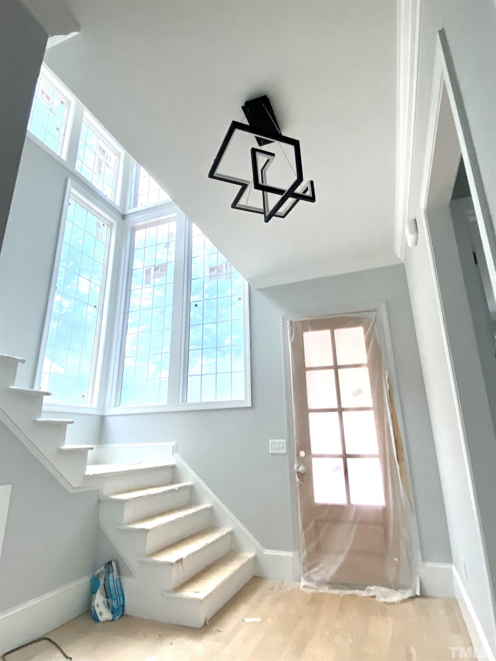 308.5 Furches Street Raleigh, NC 27607 - Photo 17 of 19 a view of wooden floor and windows in a room