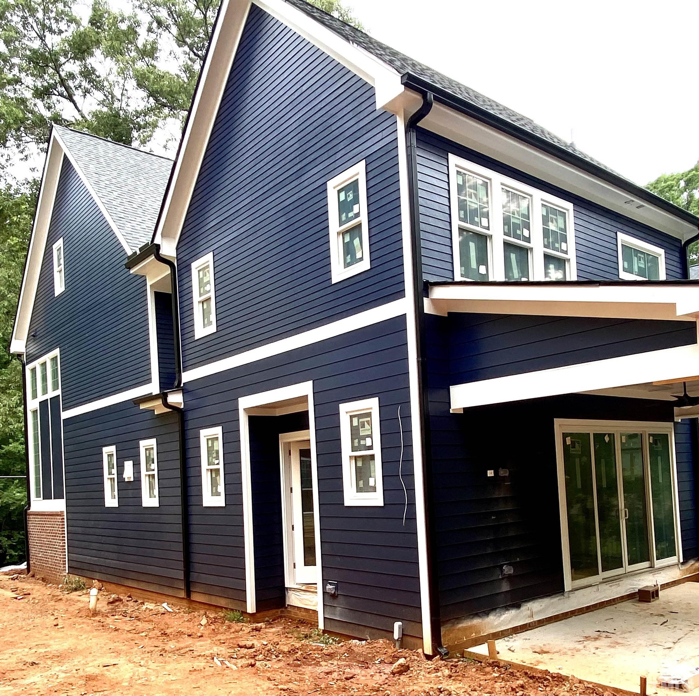 308.5 Furches Street Raleigh, NC 27607 - Photo 18 of 19 a view of a house with wooden fence and large windows