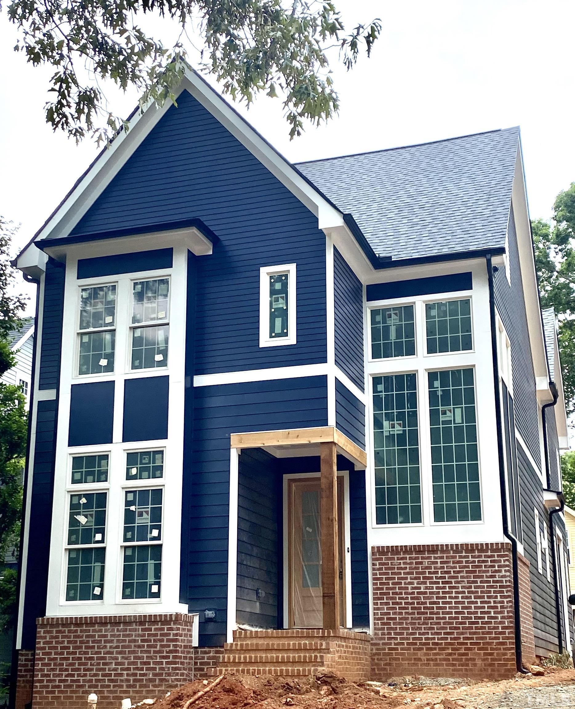 308.5 Furches Street Raleigh, NC 27607 - Photo 5 of 19 a front view of a house with glass windows