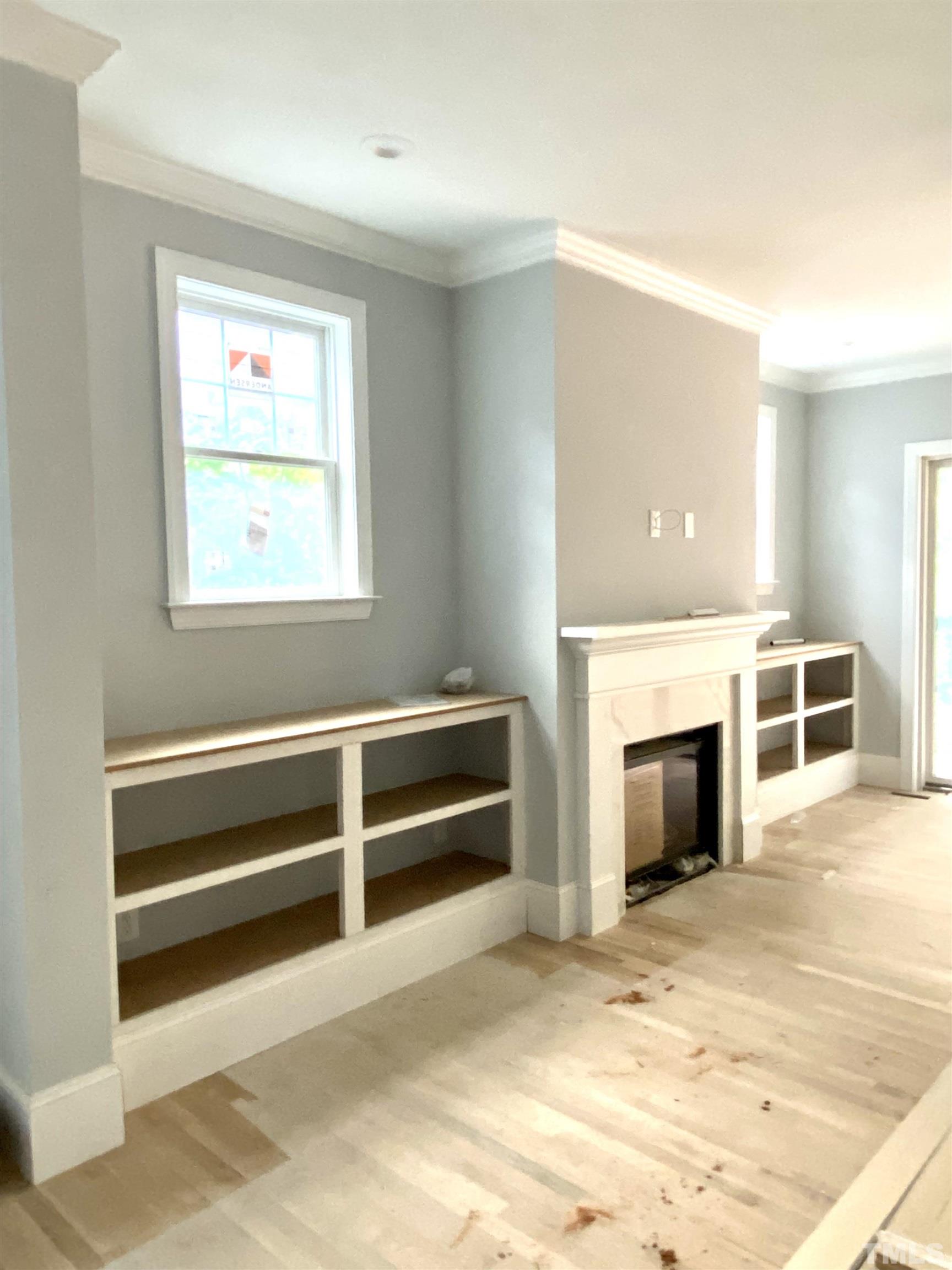 308.5 Furches Street Raleigh, NC 27607 - Photo 8 of 19 a view of an empty room with window and fire place