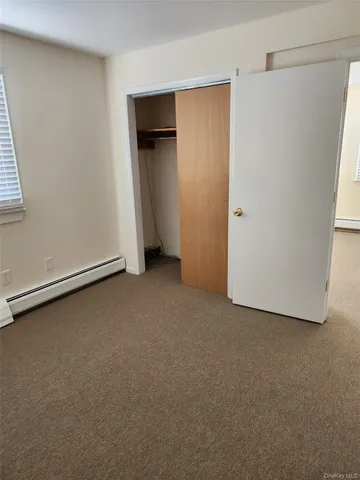 a kitchen with a refrigerator sink and cabinets