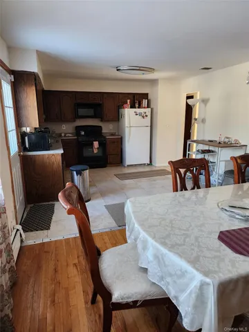 a view of a room with wooden floor and staircase