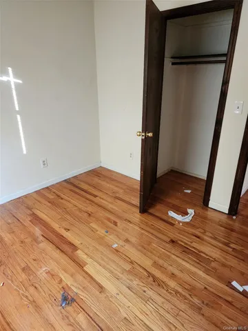 a view of roof deck with furniture and trees