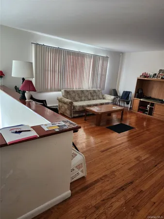 a living room with furniture pool table and a couch