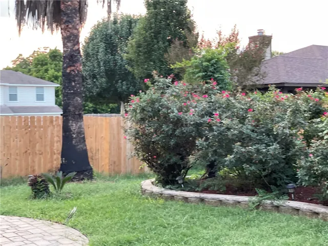 a view of a pathway with a house in the background